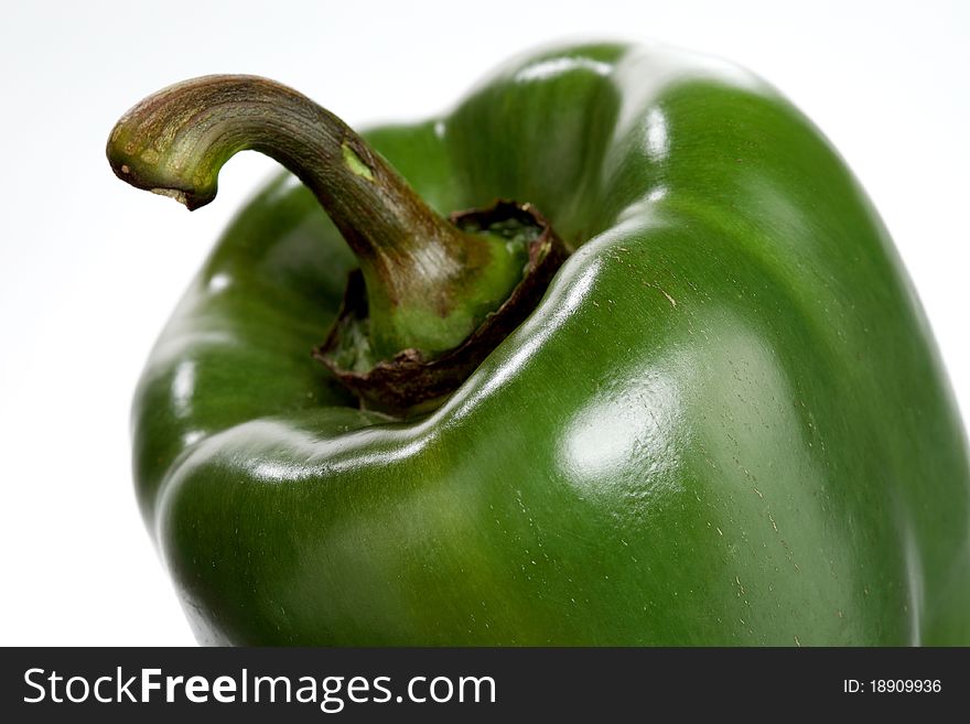 Closeup of a fresh, green pepper on a white background. Closeup of a fresh, green pepper on a white background