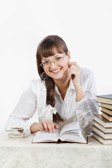 Beautiful Smiling Girl Reading A Book At The Table Royalty Free Stock Photo Beautiful Smiling Girl Reading A Book At The Table Royalty Free Stock Photo