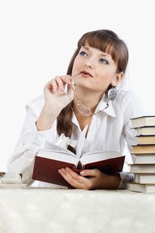 Beautiful Girl Thinking Over A Book Royalty Free Stock Images