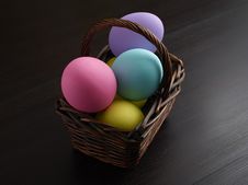Easter Eggs In Brown Basket Royalty Free Stock Photography Easter Eggs In Brown Basket Royalty Free Stock Photography