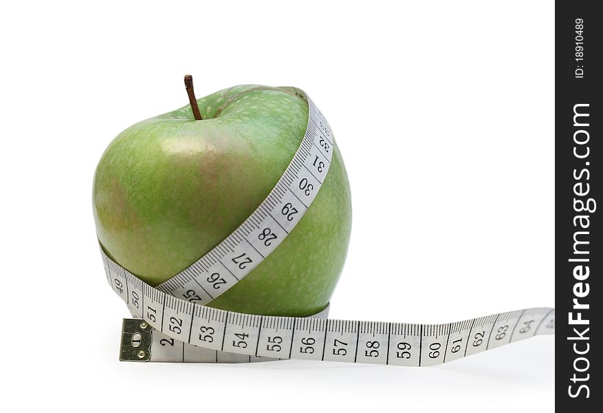 Photo of a green apple wrapped up in tailor's meter. Photo of a green apple wrapped up in tailor's meter