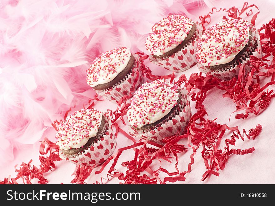 Delicious chocolate Valentine's cupcakes with pink background and copy space. Delicious chocolate Valentine's cupcakes with pink background and copy space