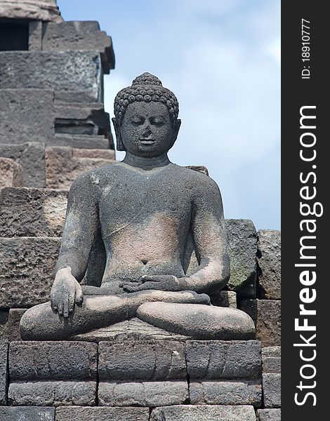 Buddha statue in Borobudur temple near Yogyakarta on Java island, Indonesia. Buddha statue in Borobudur temple near Yogyakarta on Java island, Indonesia