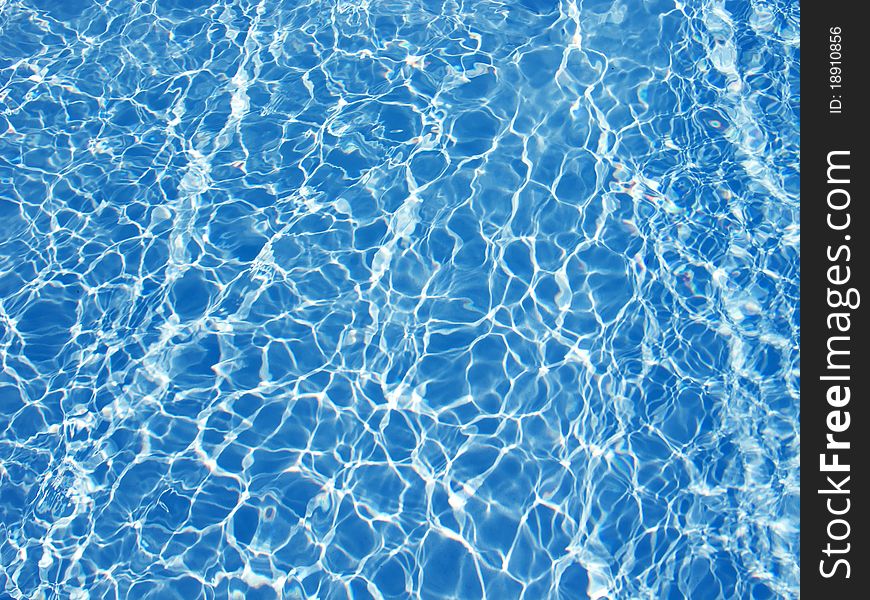 Beautiful clear pool water reflecting in the sun