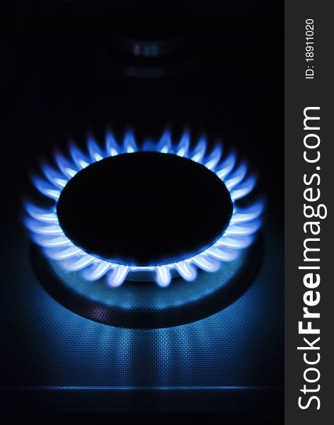 Detail of a gas burner on a dark background