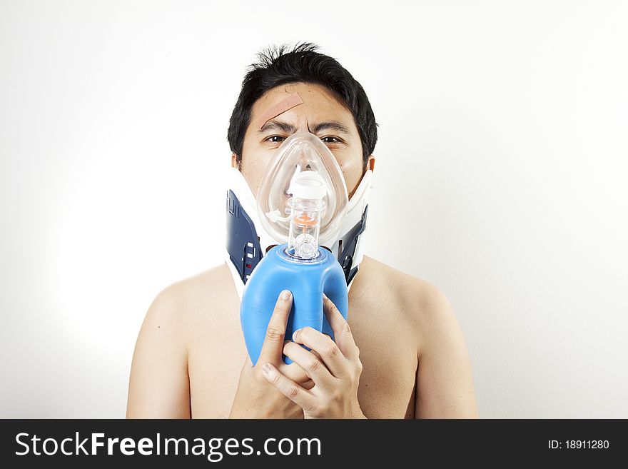 A man using resuscitator and collar to cure suffocating. A man using resuscitator and collar to cure suffocating