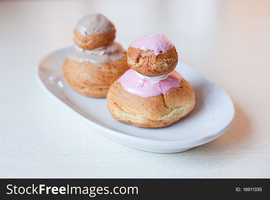 Bun with cream on the table