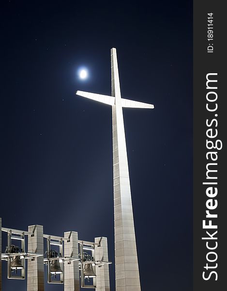 The big cross with bells at night in Rotondo Italy