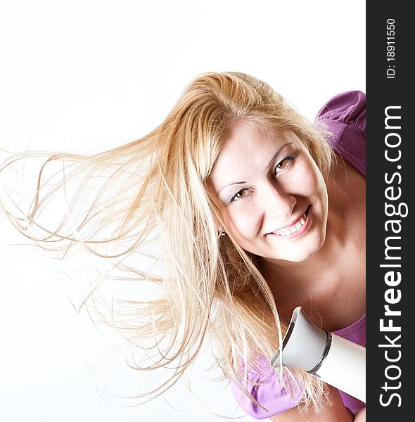 Portrait of a girl with a hairdryer