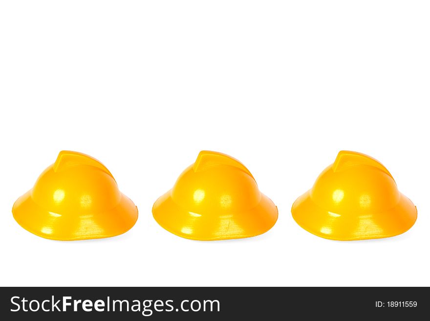 Ranked on a white background, yellow fire helmets. Ranked on a white background, yellow fire helmets