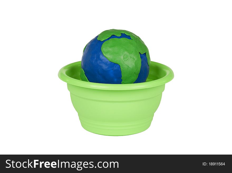 Plasticine globe in a flower pot on a white background
