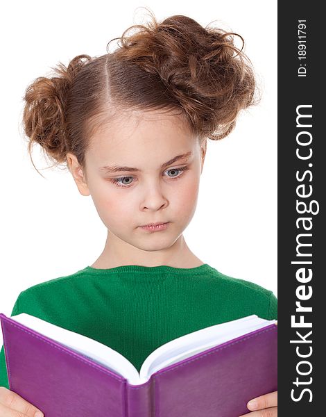 Surprised girl looking at open book