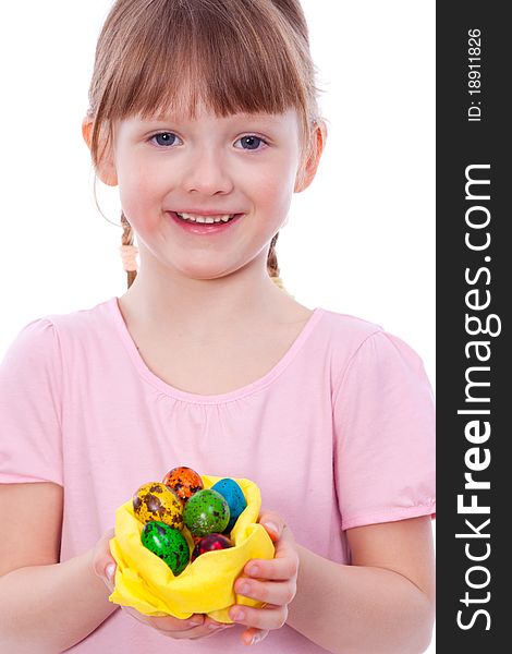 Smiling girl with Easter eggs at hands looking at camera