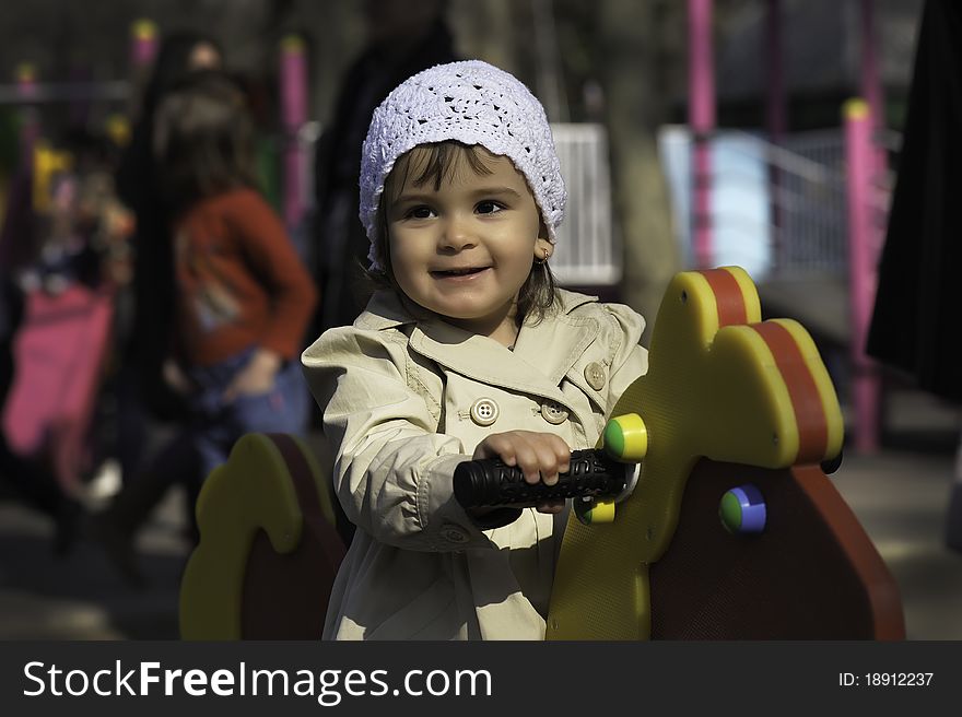 Girl play with horse in park