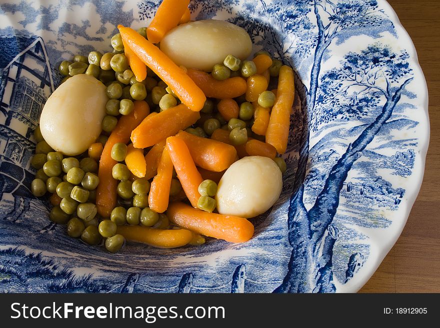 Plate of carrot, potato and peas. Plate of carrot, potato and peas