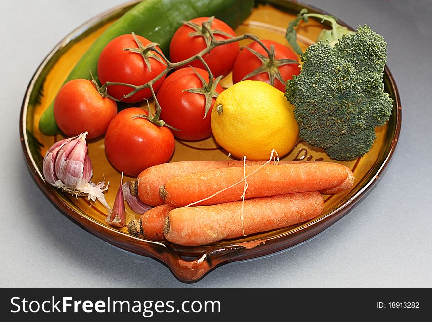 Vegetables in an earthenware dish. Vegetables in an earthenware dish.