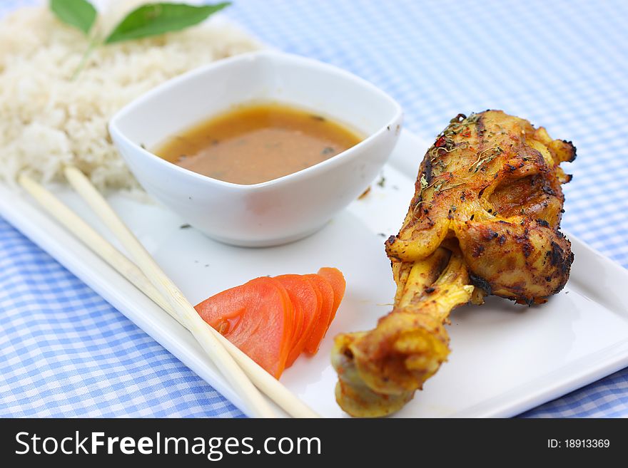 Chicken drum stick with curry sauce and rice. Chicken drum stick with curry sauce and rice