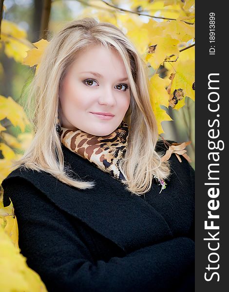 Autumn portrait of blonde girl