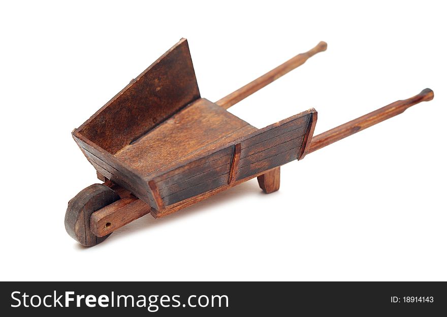 Miniature model of the wheelbarrow on white