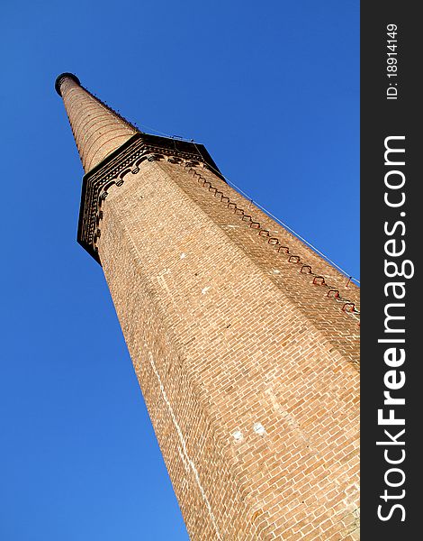 Old factory chimney reaching for the sky