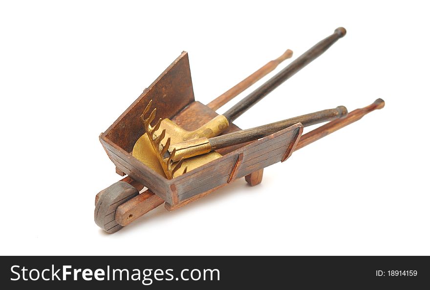 Miniature model of the wheelbarrow with tools