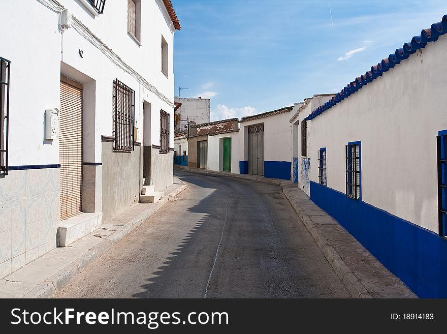 Street with white houses in small village in spain. Street with white houses in small village in spain