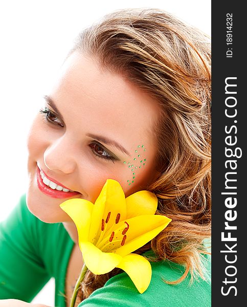 Attractive young girl with a yellow flower. Attractive young girl with a yellow flower