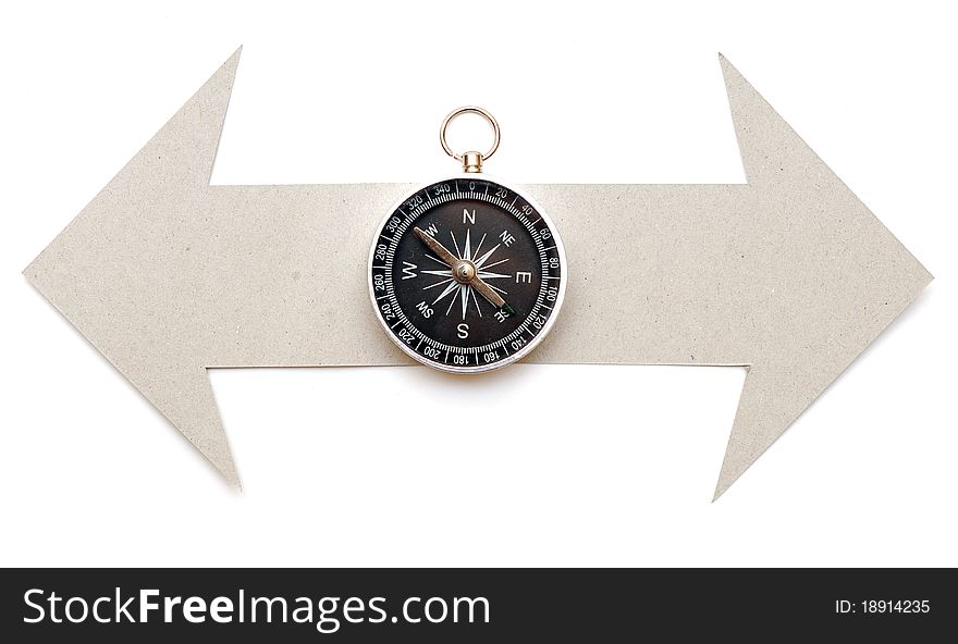 Cardboard navigation arrows with compass on a white background