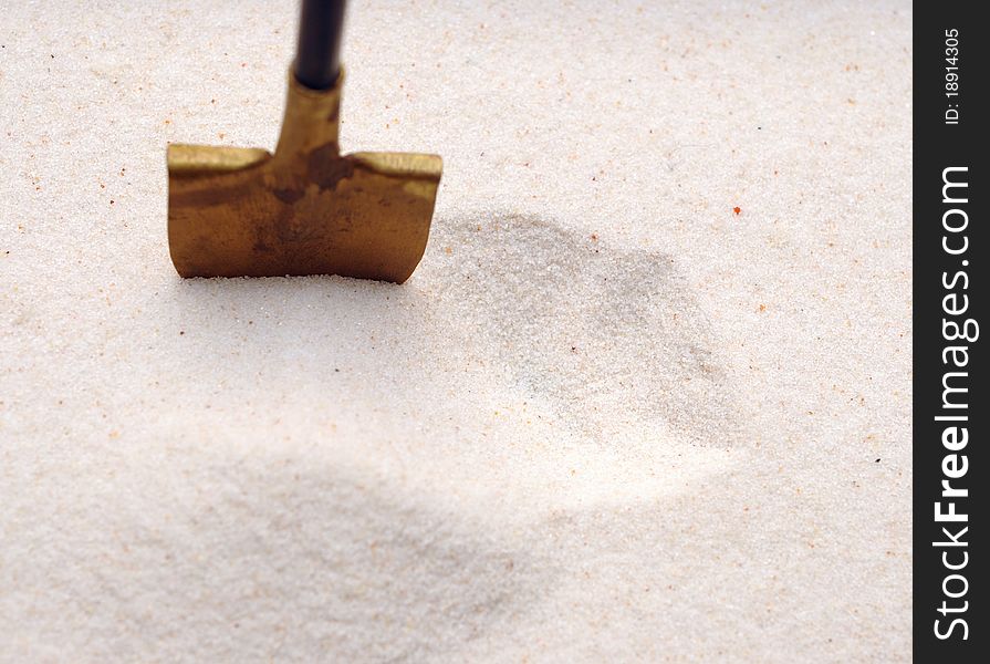 A shovel in a sand