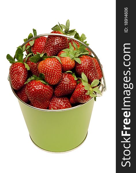 Beautiful, fresh strawberries fill this cute little green pail. Isolated on white. Studio shot. Vertical. Beautiful, fresh strawberries fill this cute little green pail. Isolated on white. Studio shot. Vertical.