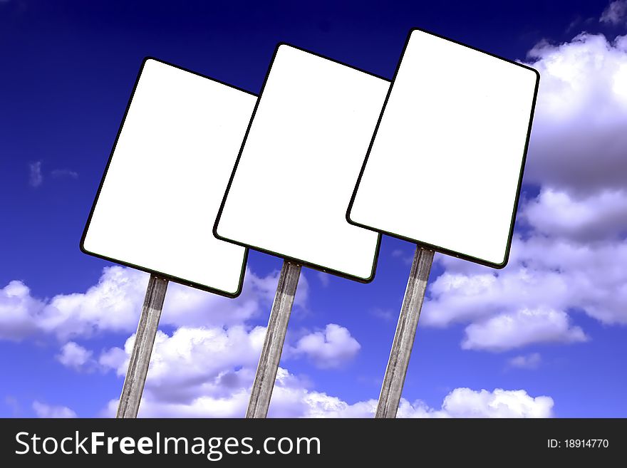 Empty billboard on a blue sky with clouds