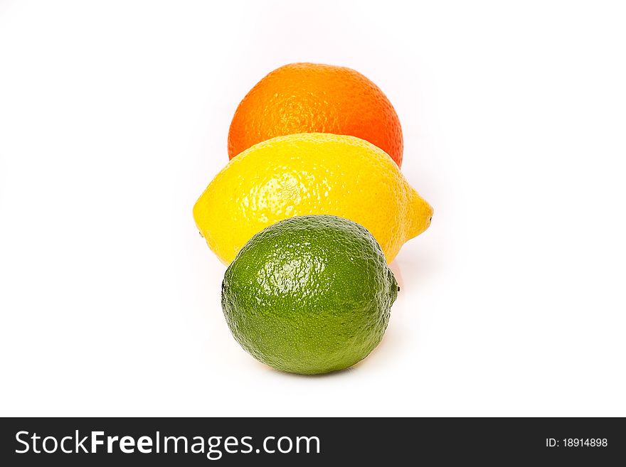 Lime with lemon and orange on the white background. Lime with lemon and orange on the white background