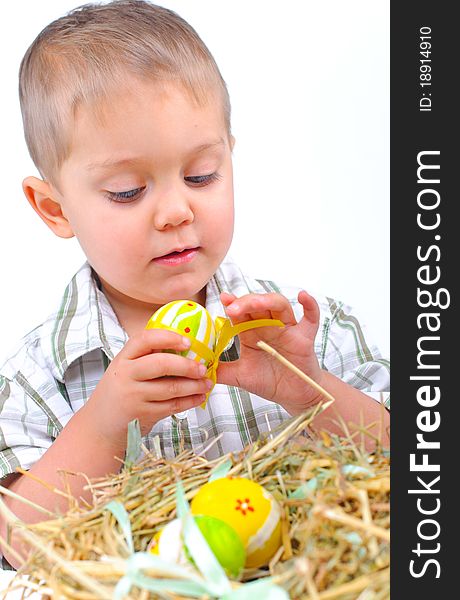 Little Boy With Easter Eggs In Basket