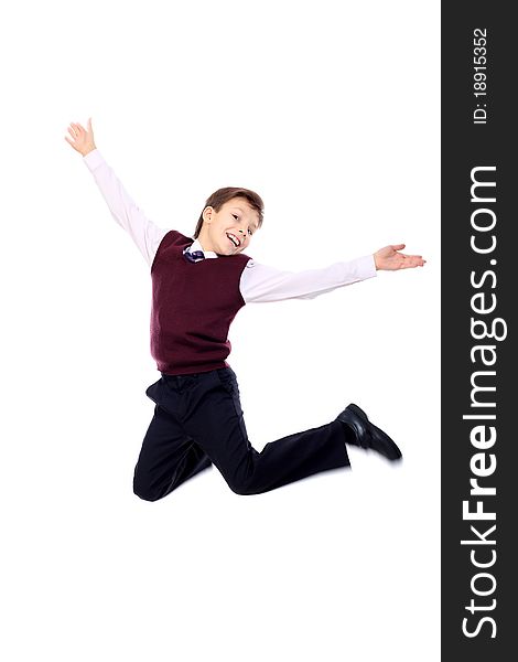 Shot of a happy jumping boy. Isolated over white background.