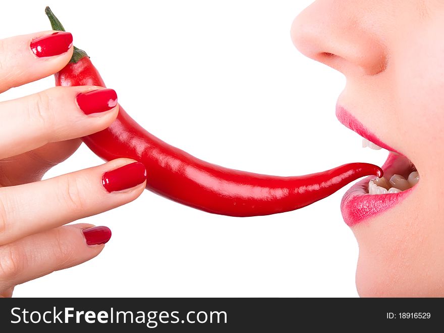 A red pepper is placed in the mouth. A red pepper is placed in the mouth
