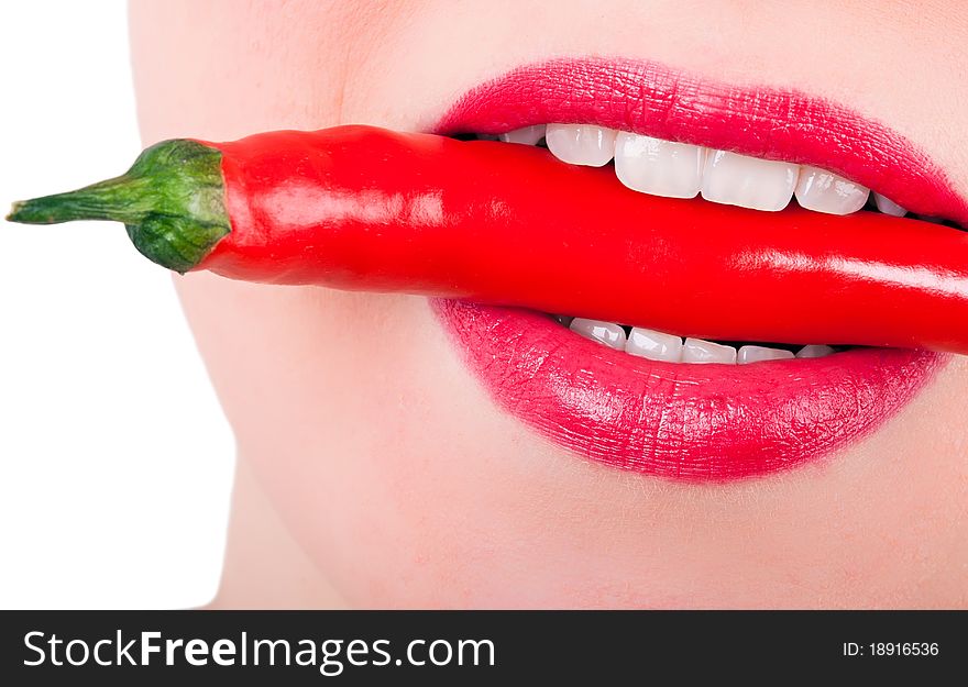 A Red Pepper Between The Teeth