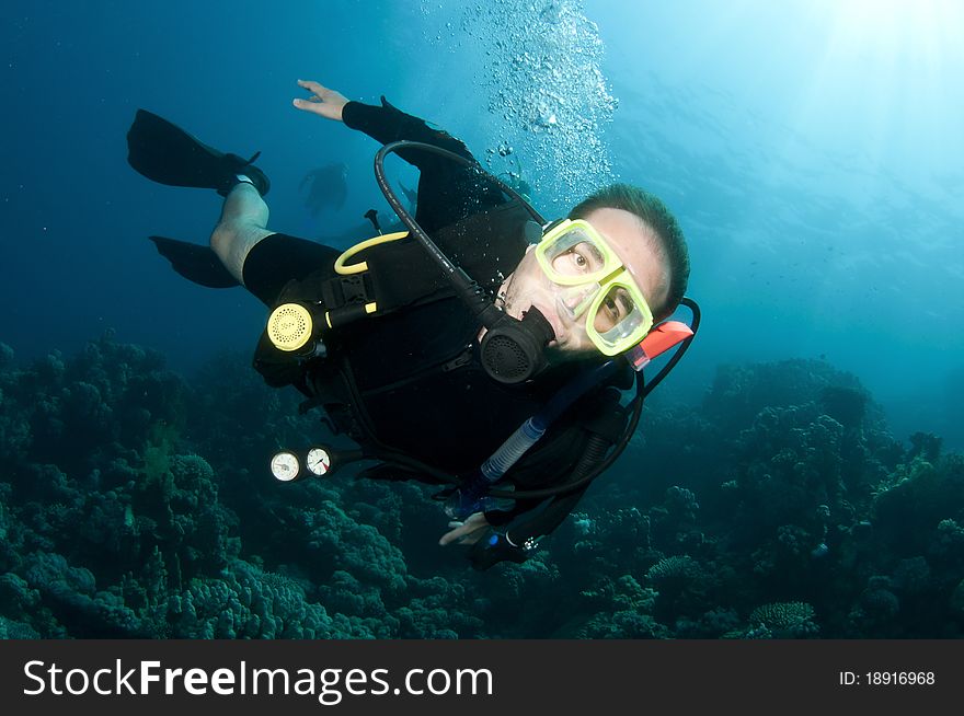 Man scuba diver on coral reef. Man scuba diver on coral reef