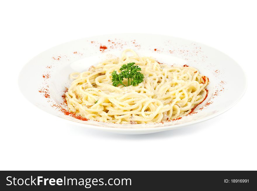 Spaghetti on the white plate decorated with parsley. Spaghetti on the white plate decorated with parsley