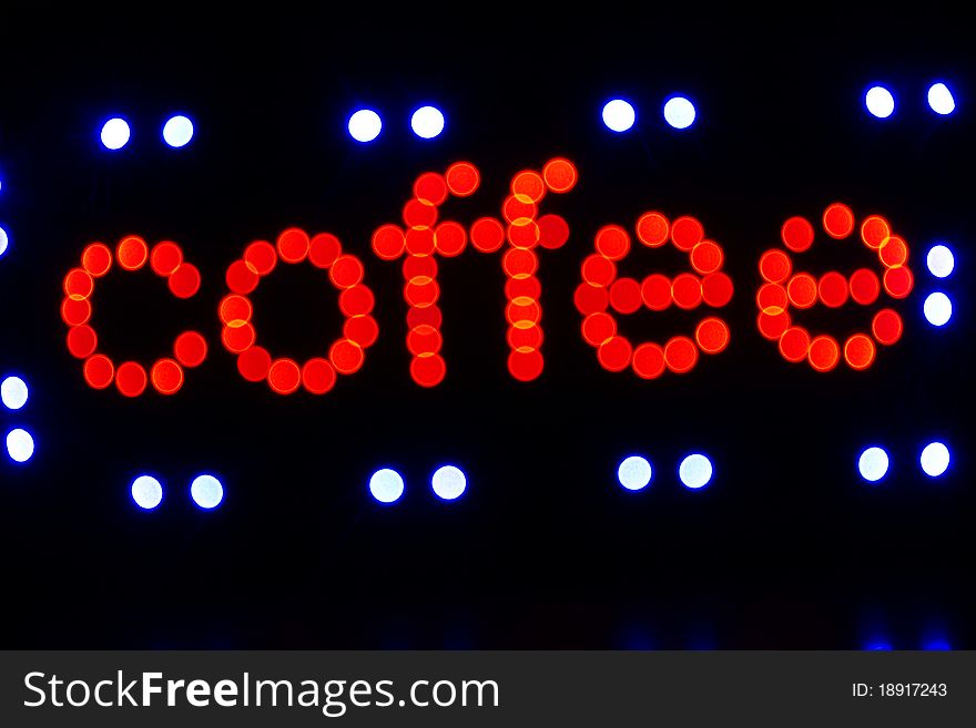 Red coffee sign by lights