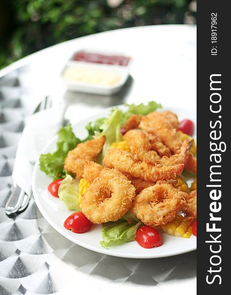 Fried calamari,shimps with vegetable and friuts. Fried calamari,shimps with vegetable and friuts.