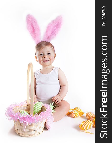 Baby playing with her first Easter basket. Baby playing with her first Easter basket