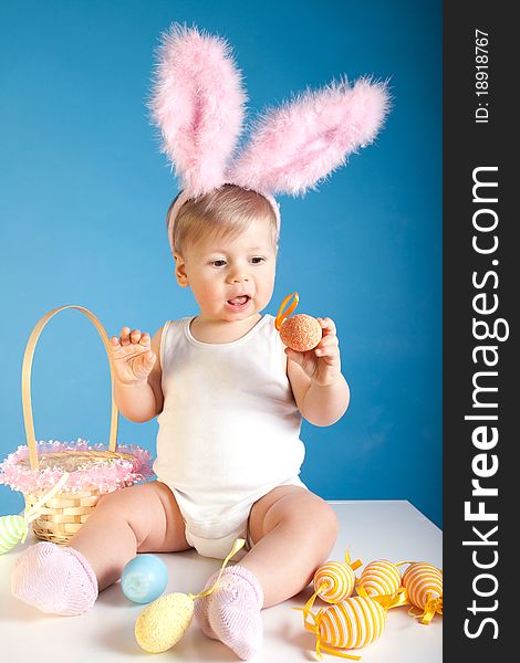 Baby playing with her first Easter basket. Baby playing with her first Easter basket