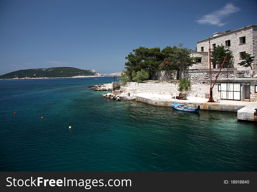 Close up view to port with boat, croatian island Rab. Close up view to port with boat, croatian island Rab