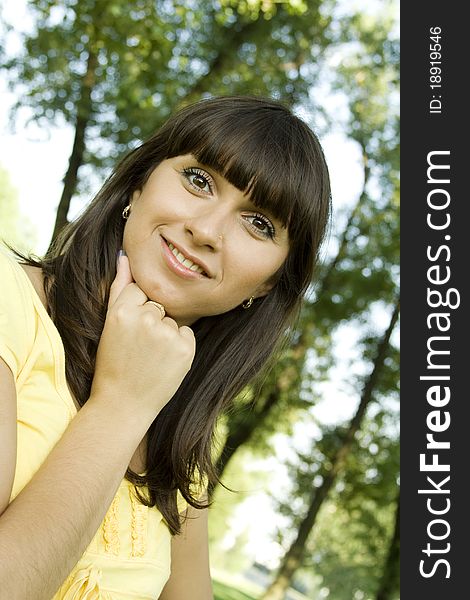 Beautiful young woman outdoors in nature. Portrait. Beautiful young woman outdoors in nature. Portrait