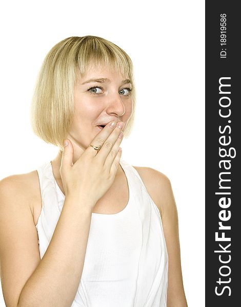 Close-up of a young woman looking surprised on white background