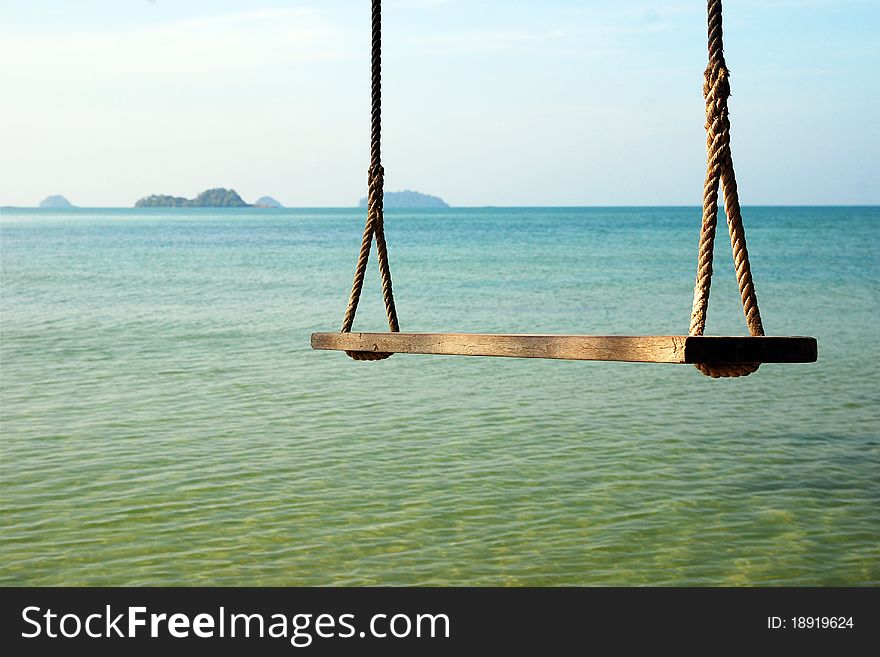 Swings sea beach background holiday