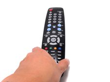 Hand Holding A Black Remote Control , Vertical Stock Photography