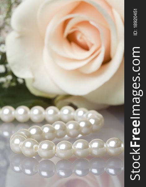 Pearl necklace with beautiful cream rose