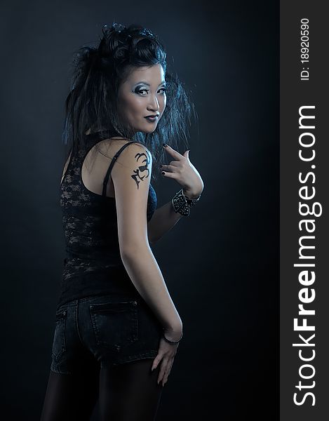 Gothic asian girl on black background