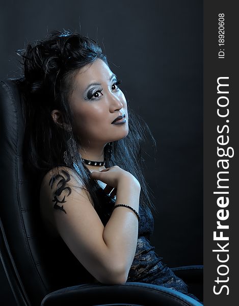 Gothic asian girl on black background